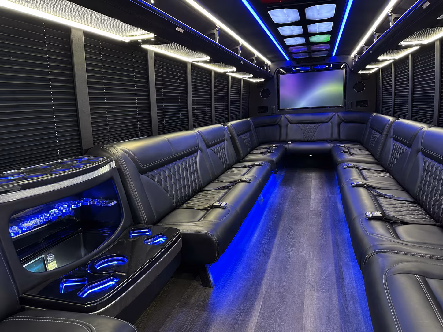 Friends laughing during a party bus celebration in Torrance
